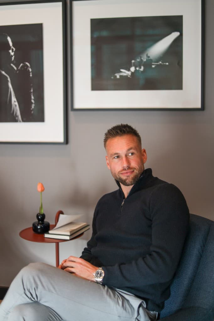 Kevin seated in an armchair